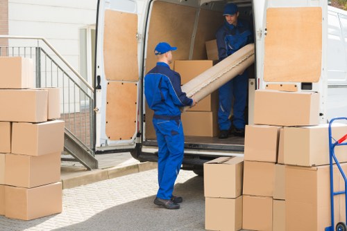 Man with van service loading items in Soho street