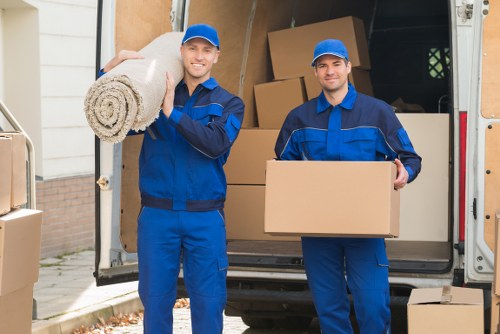 Workers preparing safe loading procedures for a man and van job