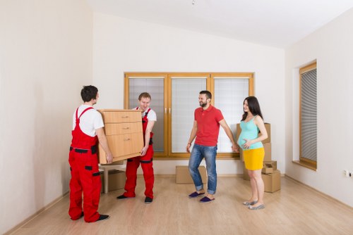 Professional removals team handling a move in a busy Soho street