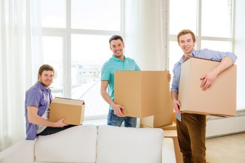 Movers handling furniture in a Soho apartment building