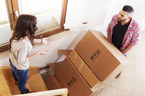 Professional movers loading household items for a Soho relocation