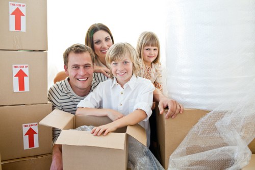 Professional movers handling office equipment in central London