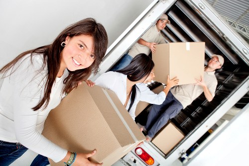 Removal van loading household items for a move near Soho